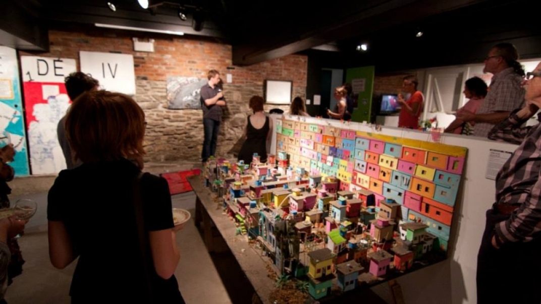 people around various art exhibits