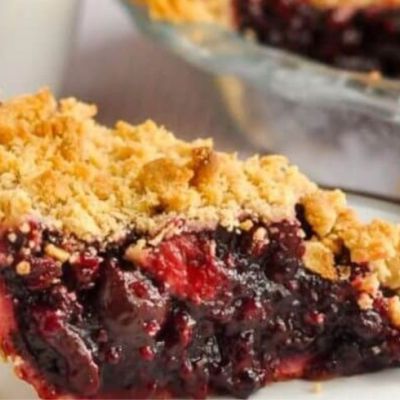 cherry pie on a plate with gold detailing