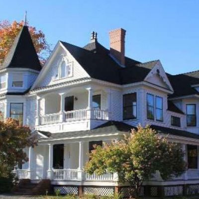 External shot of a white Victorian-style two-story house