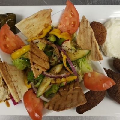 an appetizer plate with a dipping sauce