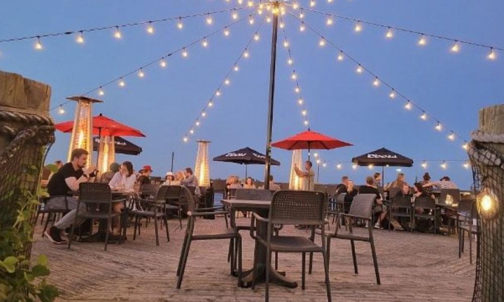 outdoor patio with string lights and red umbrellas