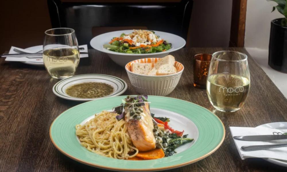 plate of pasta and fish with white wine